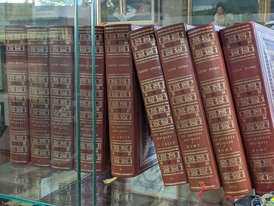 many books on display in a glass case