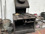 a stove that is sitting in the corner of a room
