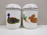 two salt and pepper shakers decorated with animals on them