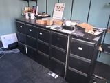 a room with a desk, shelves, and a chair in it