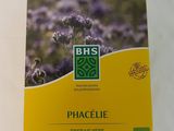 une boîte de thé à la phacélie posée sur une table blanche