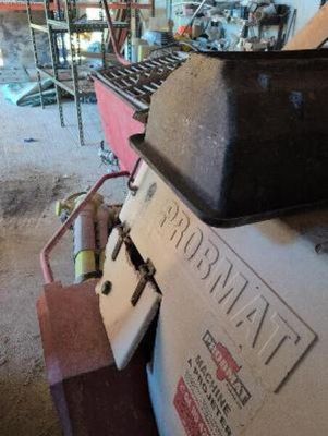 an image of a machine in a garage that is being worked on