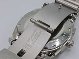 an image of a close up of a watch on a white surface