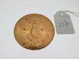 a close up of a coin with a price tag on it