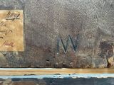 a sign on the side of a building that says ww