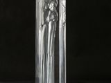 a glass sculpture of an angel on a pedestal