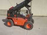a picture of a forklift parked in front of a building