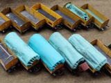 a lot of toy trains that are sitting on the floor