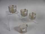 three clear cups with numbers on them are sitting on a table