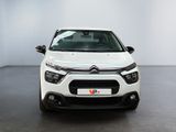 a white citrole is parked in a white room