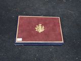 a red book with a gold emblem on it