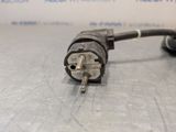 a close up of a plug on a metal surface with a white background
