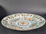pair of antique hand painted ceramic bowls with floral designs on them