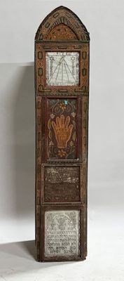 a tall clock that is sitting on the floor