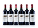 six bottles of red wine lined up on a white surface