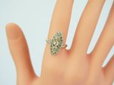 an image of a woman ' s hand with a ring on it ' s finger