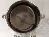 a metal pot with a strainer on top of it