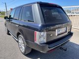 a picture of a black land rover parked in a parking lot