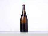 a bottle of wine sitting on a table with a white background