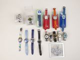 a lot of watches that are sitting on a table