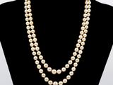 a double strand pearl necklace on a mannequin mannequin