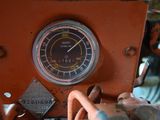 a close up of a clock on the side of a vehicle