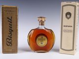 an image of a bottle of brandy sitting next to a box