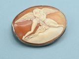 a picture of a pin with a picture of an angel on it