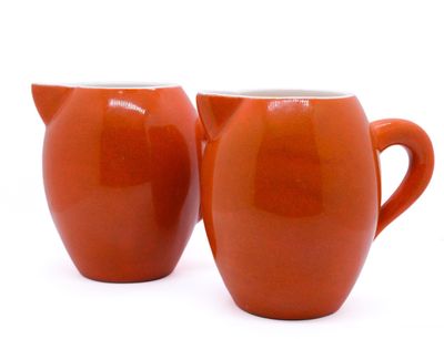 pair of orange jugs on a white background with a white background