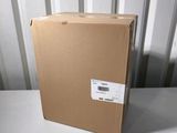 an open box sitting on top of a white table next to a wall