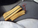 two pieces of wood sitting on the seat of a car