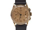 an image of a gold wrist watch with black leather strap