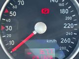 a close up of a speedometer on a car ' s dashboard
