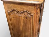an old wooden cabinet with a drawer on top of it
