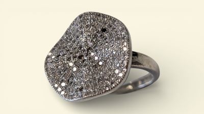 an image of a silver ring with a large druzy stone on it