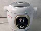 a white and silver electric pressurer on a counter
