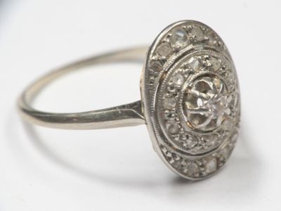 an image of a diamond ring on a white surface