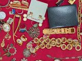 a red display case filled with lots of jewelry