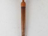 an image of a wooden hammer with colorful dots on it