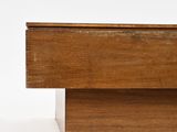 an old wooden box with a drawer on top of it