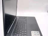 a black laptop computer sitting on top of a white table