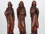 three carved wood figures of jesus and mary