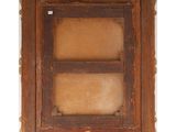 an old wooden picture frame with a small window in the middle