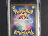 a close up of a pokemon card in a plastic case