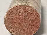 a close up of a piece of wood on a table