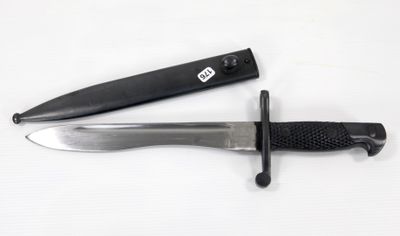 a knife that is laying on a table next to a knife