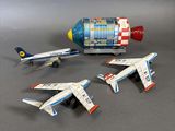 three toy airplanes sitting next to each other on a table