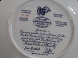 a white plate with a blue and white design on it