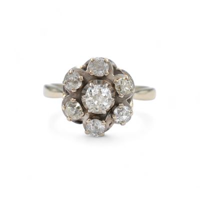 a close up of a diamond ring on a white background