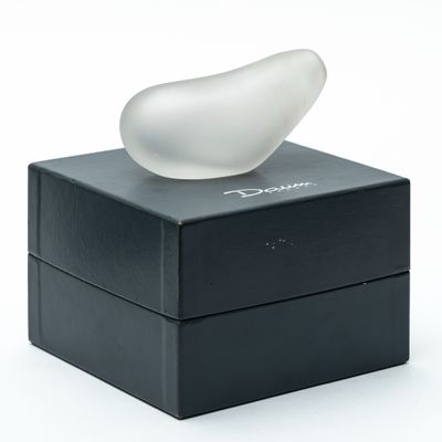 a white object sitting on top of a black box